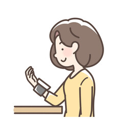 血圧を測定する女性　手首式測定機