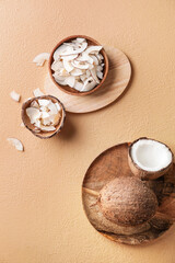 Composition with tasty coconut chips on color background