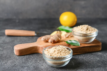 Composition with ginger powder on dark background