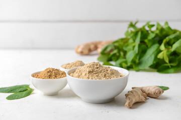 Composition with ginger powder on light background