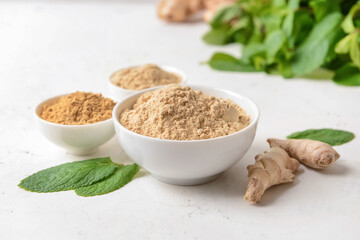 Composition with ginger powder on light background