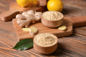 Composition with ginger powder on wooden background