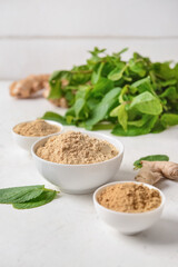 Composition with ginger powder on light background