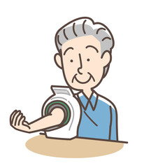 血圧を測定するおじいさん　上腕式測定機
