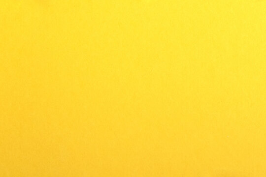 Empty yellow paper backgrounds. Clean color texture with simple surface. High resolution.