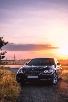 Kherson, Ukraine - June 2019. BMW 5-series F10 against the backdrop of a beautiful sunset.