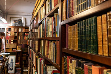 old library shelves with books

