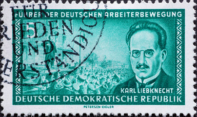 GERMANY, DDR - CIRCA 1955 : a postage stamp from Germany, GDR showing a portrait of the co-founder of the KPD, Karl Liebknecht, rally text: Leader of the German labor movement