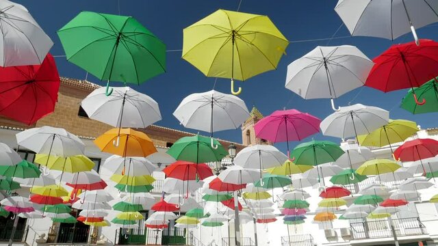 Umbrella Sky Project in Torrox Pueblo, Malaga, Spain, wide shot dolly left