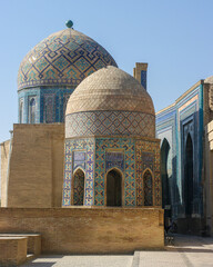 Fototapeta na wymiar View of beautiful medieval mausoleums with blue tile decoration at Shah-i-Zinda necropolis in UNESCO listed Samarkand, Uzbekistan