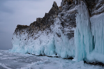Amazing landscape with rock on the ice of Baikal in winter
