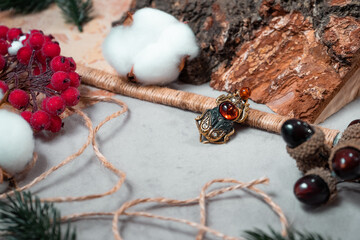 Bronze and amber pendant in the form of scarab.