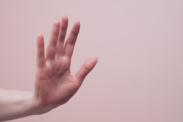 Female hand showing no and stop gesture. Preventing domestic violence and abuse concept