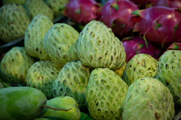 Fototapeta premium Piles of custard apple sold in the market.