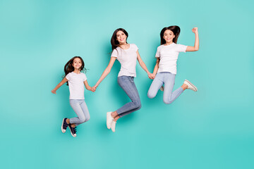 Fototapeta na wymiar Full length body size photo sisters jumping up wearing casual outfits happy won lottery isolated vivid blue color background