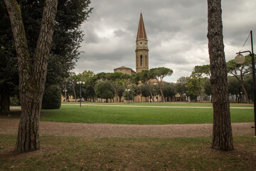 Fototapeta premium Park near cathedral Arezzo with tower Piazetta dietro il Duomo in historical city in Tuscany, Italy