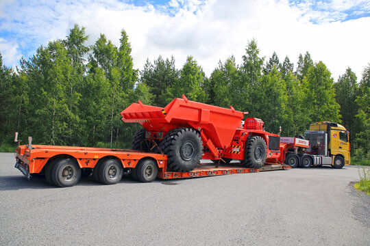 Silvasti Truck Hauls Sandvik Mining Vehicle Rear View