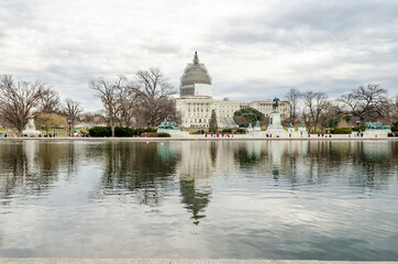 Panoramic View of United States Capitol Building and Reflecting Pool in Washington DC, USA. The...