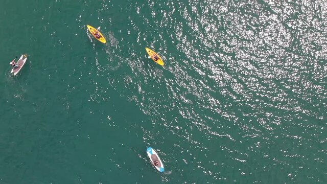 Aerial view directly above kayaks and paddleboarders, Torrox, Malaga, Spain