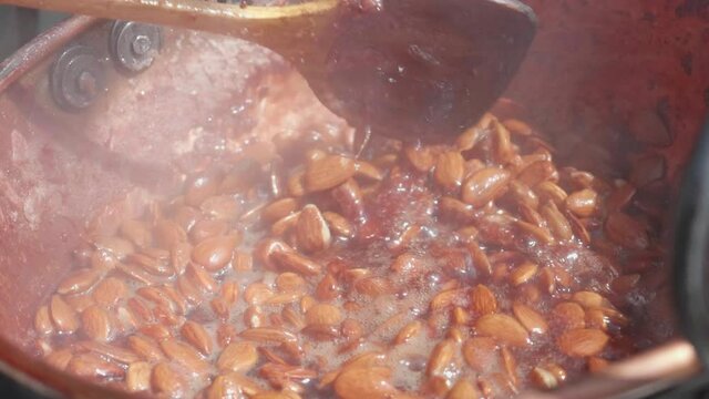 Caramelised almonds prepared by street vendor, Mijas, Malaga, Spain, close up