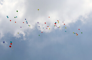 colorful balloons fly high in the sky after the big celebration