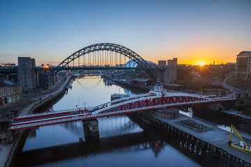 The bridges between Gateshead and Newcastle-upon-Tyne on the River Tyne with a stunning sunrise.