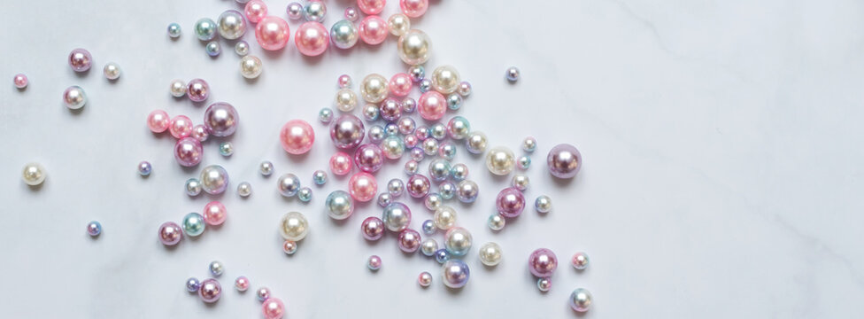 Pearls background. Pearls on marble background. Fashion and luxury jewelry concept