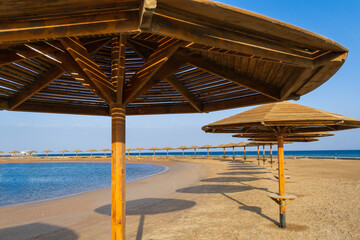 Sunset on the beach with parasol overlooking the Red Sea in Hurghada, Egypt