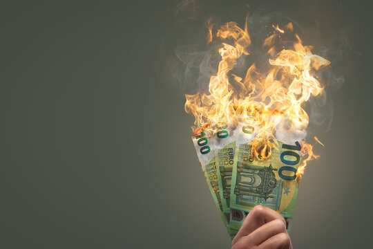 Burning money - 100 Euro banknotes on fire