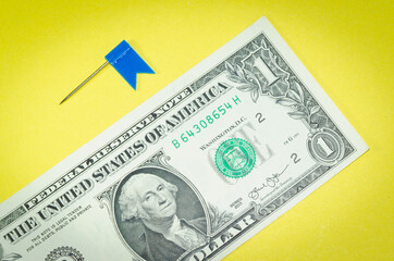 One dollar and blue flag.