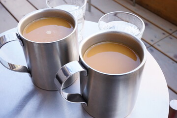 Silver cup of coffee on the table - コーヒー 銀のカップ