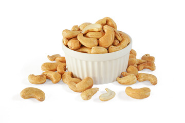 Roasted Cashew nuts in white cup isolated on white background with clipping path