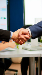 Satisfied businessman company employer wearing suit handshake new employee get hired at job...