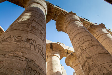 KARNAK TEMPLE - Massive columns inside beautiful Egyptian landmark with hieroglyphics, and ancient...