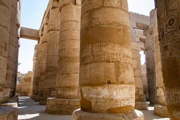 KARNAK TEMPLE - Massive columns inside beautiful Egyptian landmark with hieroglyphics, and ancient...