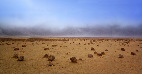 Empty Barren Landscape of Planet Mars. Dry desert alien world with only rocks, soil and a blue sky. - 416703123