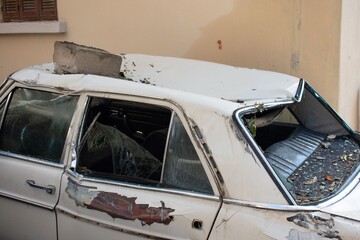 Fototapeta premium car wrecked by debris from an explosion in Beirut center in August 2020