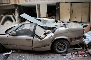 Fototapeta premium car wrecked by debris from an explosion in Beirut center in August 2020