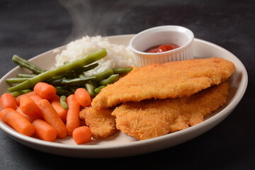 Israeli schnitzel made of chicken or turkey breast, coated with a mixture of beaten eggs and bread...
