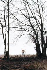 walking in the forest.man looking into mist