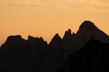 Misty sunset with beautiful silhouette of mountain range in Switzerland