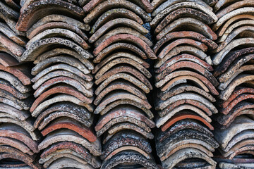 Close up of old stacked roof tiles.