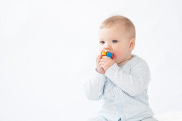Pretty baby/infant plays with a toy
