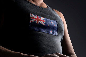 The national flag of New Zealand on the athlete's chest