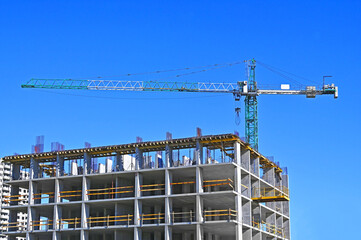 Crane and highrise construction site