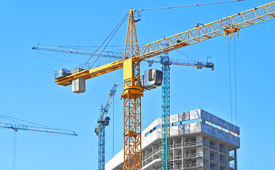 Crane and highrise construction site