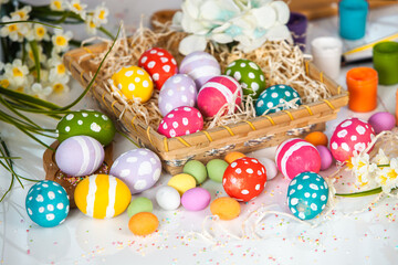 Hand painted pastel colored Easter eggs background. Happy Easter greeting card or invitation.