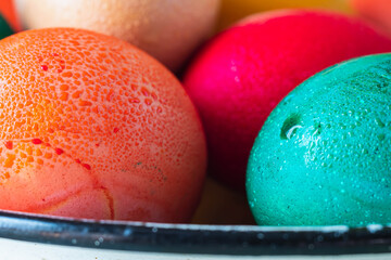 still life colored easter eggs in rustic style blur background