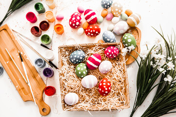 Hand painted pastel colored Easter eggs background. Happy Easter greeting card or invitation.