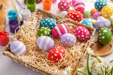 Hand painted pastel colored Easter eggs background. Happy Easter greeting card or invitation.